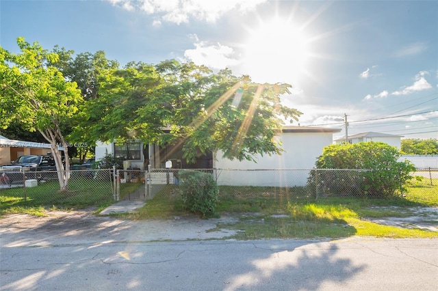 7190 NW 21st Ave, Miami, FL 33147 - view of property hidden behind natural elements with a fenced front yard and a gate