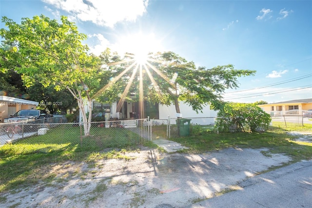 7190 NW 21st Ave, Miami, FL 33147 - rear view of property with a gate and a fenced front yard