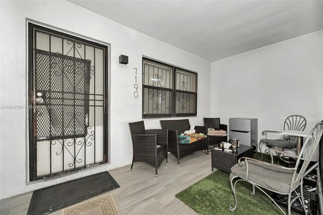 7190 NW 21st Ave, Miami, FL 33147 - doorway to property with outdoor lounge area