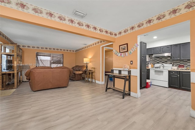 7190 NW 21st Ave, Miami, FL 33147 - living area featuring light wood finished floors and recessed lighting