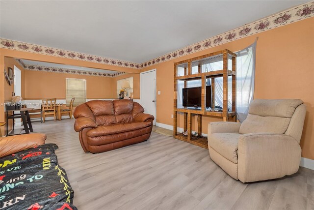 7190 NW 21st Ave, Miami, FL 33147 - living area featuring wood finished floors and baseboards