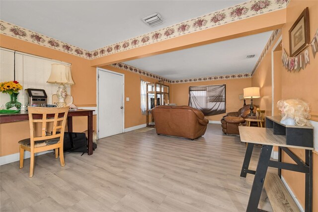 7190 NW 21st Ave, Miami, FL 33147 - living area with light wood-style flooring and baseboards