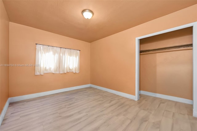7190 NW 21st Ave, Miami, FL 33147 - unfurnished bedroom featuring wood finished floors and a closet