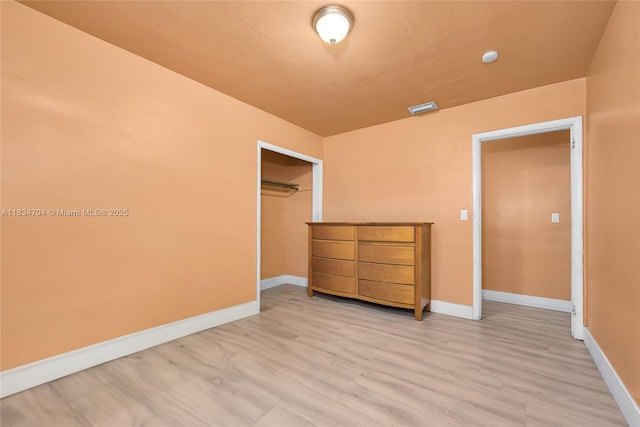 7190 NW 21st Ave, Miami, FL 33147 - unfurnished bedroom featuring a closet and light wood-style flooring