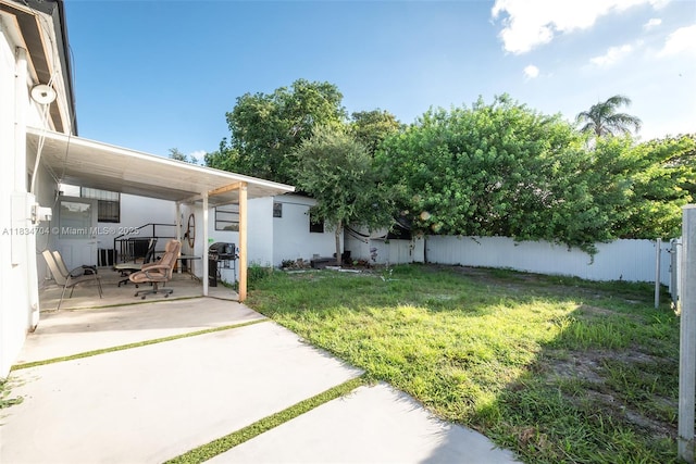 7190 NW 21st Ave, Miami, FL 33147 - fenced backyard with a patio area