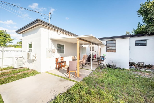 7190 NW 21st Ave, Miami, FL 33147 - rear view of property with a patio area and stucco siding
