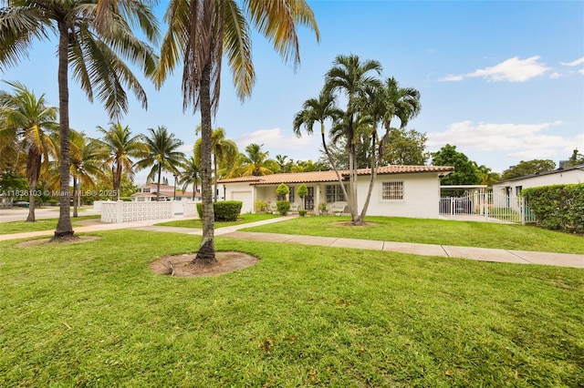 811 SW 25th Rd, Miami, FL 33129 - view of front of property with stucco siding, a garage, and driveway
