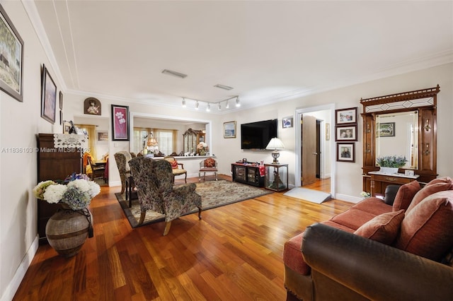 811 SW 25th Rd, Miami, FL 33129 - living area featuring wood finished floors, crown molding, and rail lighting