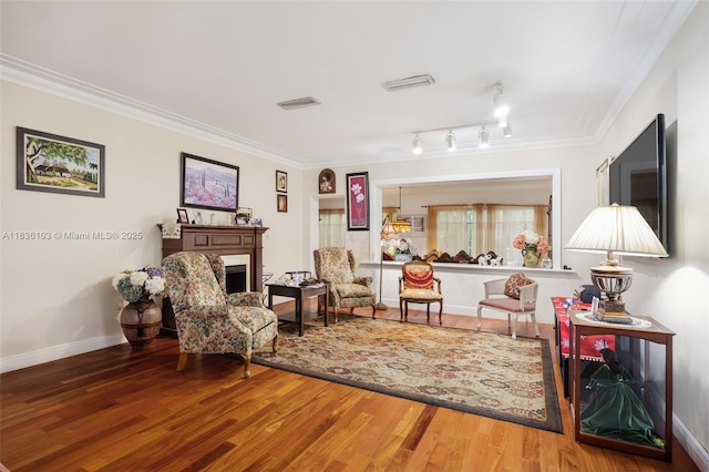 811 SW 25th Rd, Miami, FL 33129 - living area featuring wood finished floors, crown molding, and a fireplace