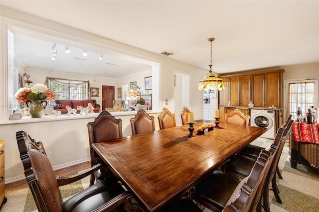 811 SW 25th Rd, Miami, FL 33129 - dining area with washer / dryer and ornamental molding