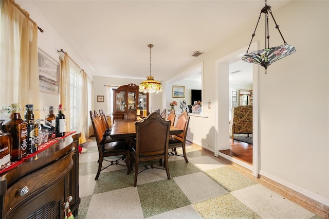 811 SW 25th Rd, Miami, FL 33129 - dining area with baseboards and a chandelier