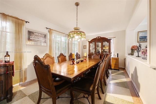 811 SW 25th Rd, Miami, FL 33129 - dining space featuring dark aggregate flooring and baseboards