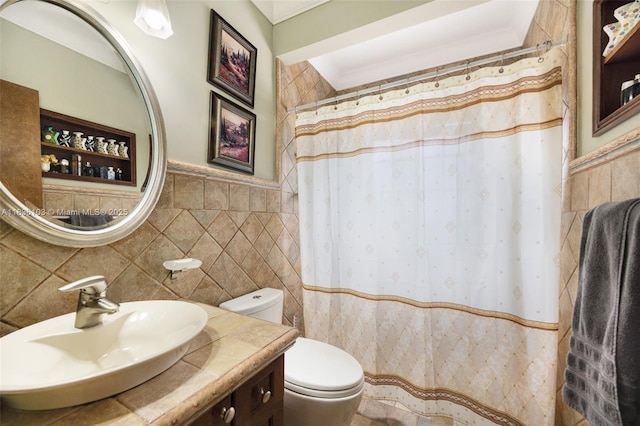 811 SW 25th Rd, Miami, FL 33129 - full bathroom featuring tile walls, vanity, wainscoting, and curtained shower