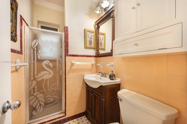 811 SW 25th Rd, Miami, FL 33129 - bathroom featuring tile walls, vanity, a shower stall, crown molding, and wainscoting
