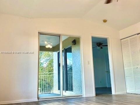 1865 Palm Cove Blvd Unit 9-306, Delray Beach, FL 33445 - doorway with ceiling fan, lofted ceiling, and wood finished floors