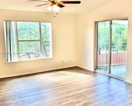 1865 Palm Cove Blvd Unit 9-306, Delray Beach, FL 33445 - unfurnished room with a ceiling fan and wood finished floors