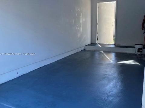 1865 Palm Cove Blvd Unit 9-306, Delray Beach, FL 33445 - empty room featuring finished concrete flooring
