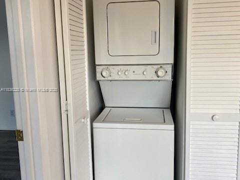 1865 Palm Cove Blvd Unit 9-306, Delray Beach, FL 33445 - laundry area with stacked washer / drying machine