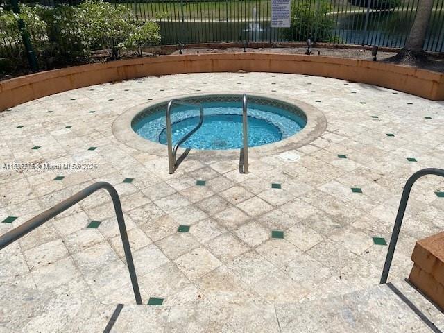 1865 Palm Cove Blvd Unit 9-306, Delray Beach, FL 33445 - view of pool featuring a community hot tub