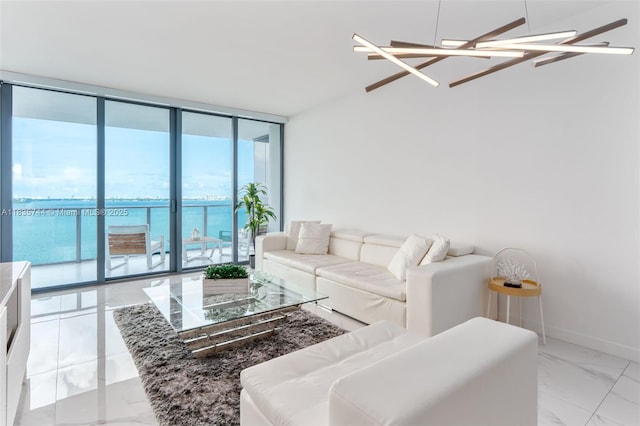 3131 NE 7th Ave Unit 1202, Miami, FL 33137 - living area with a wall of windows, light marble finish floors, and a water view