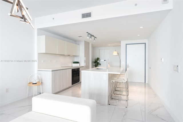 3131 NE 7th Ave Unit 1202, Miami, FL 33137 - kitchen featuring oven, modern cabinets, light marble finish flooring, light countertops, and recessed lighting