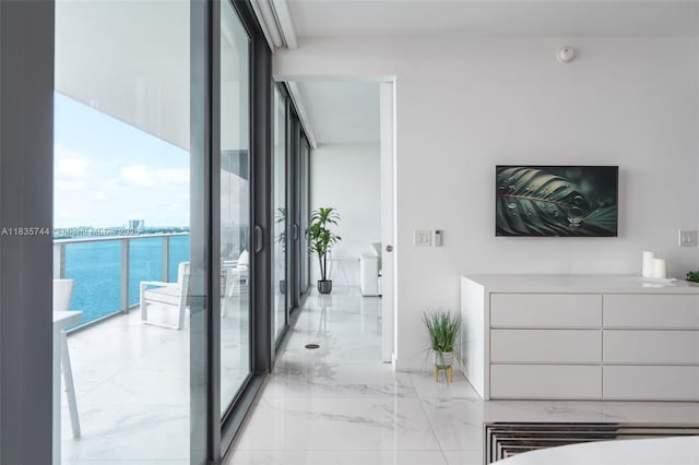 3131 NE 7th Ave Unit 1202, Miami, FL 33137 - corridor featuring plenty of natural light, expansive windows, and light marble finish floors