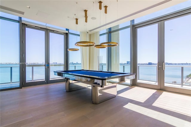 3131 NE 7th Ave Unit 1202, Miami, FL 33137 - playroom with french doors, wood finished floors, a water view, and expansive windows