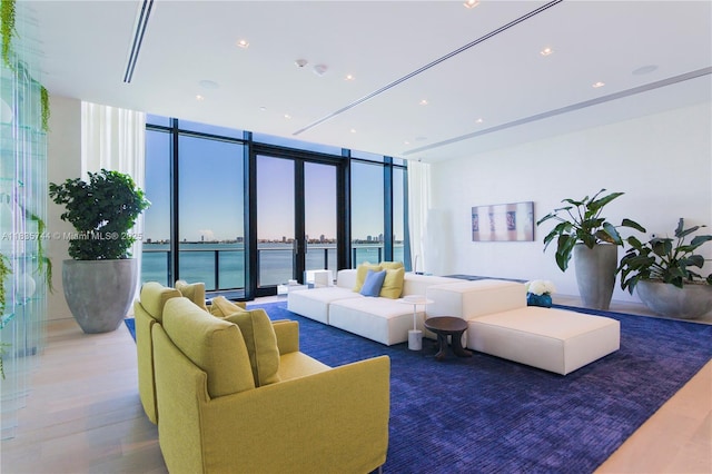 3131 NE 7th Ave Unit 1202, Miami, FL 33137 - living room with floor to ceiling windows, wood finished floors, and a water view