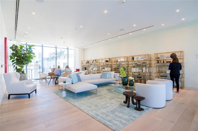 3131 NE 7th Ave Unit 1202, Miami, FL 33137 - living area with wood finished floors, expansive windows, and recessed lighting
