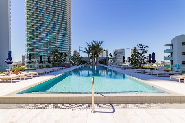 3131 NE 7th Ave Unit 1202, Miami, FL 33137 - community pool featuring a patio area and a view of city