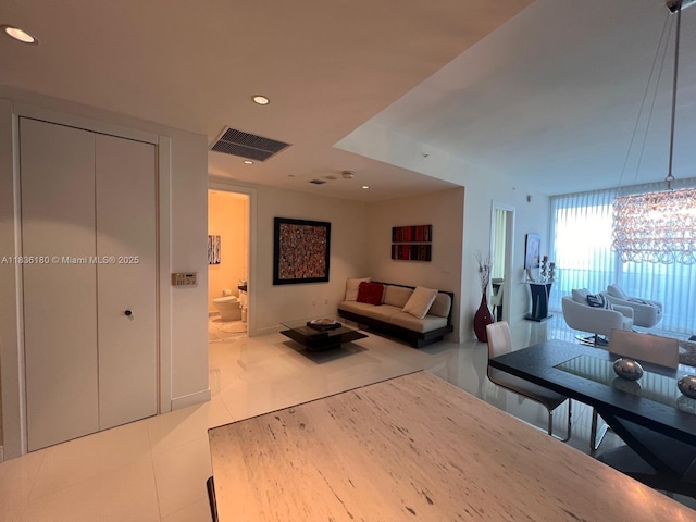 200 Biscayne Boulevard Way Unit 4603, Miami, FL 33131 - tiled living room with recessed lighting and a chandelier