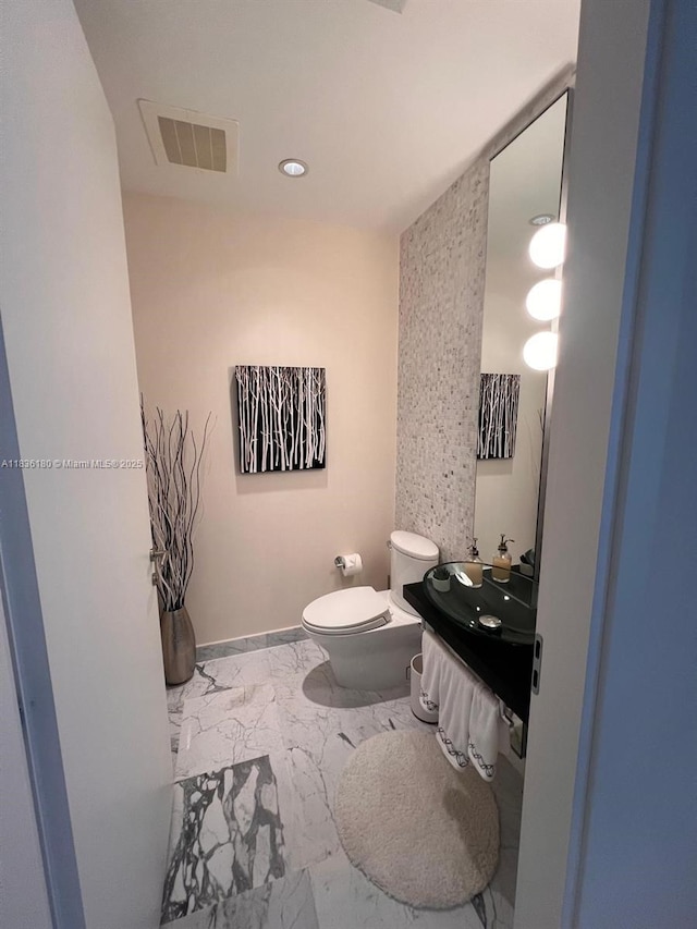 200 Biscayne Boulevard Way Unit 4603, Miami, FL 33131 - bathroom with marble look tiles, vanity, and recessed lighting