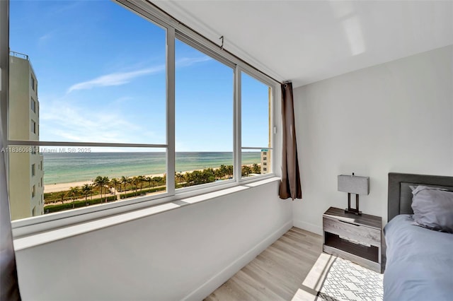 5005 Collins Ave Unit 815, Miami Beach, FL 33140 - bedroom with light wood finished floors and a water view