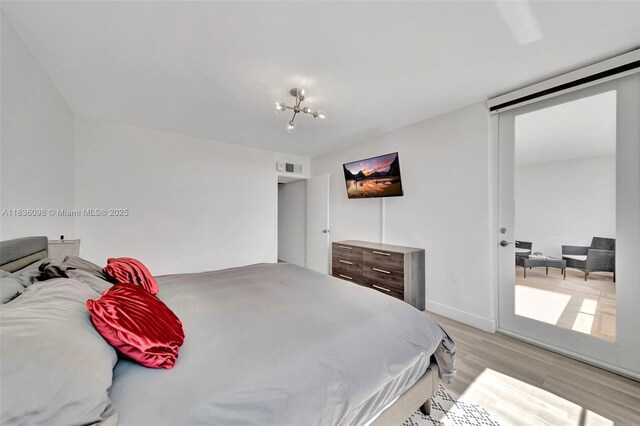 5005 Collins Ave Unit 815, Miami Beach, FL 33140 - bedroom featuring light wood-style flooring and baseboards