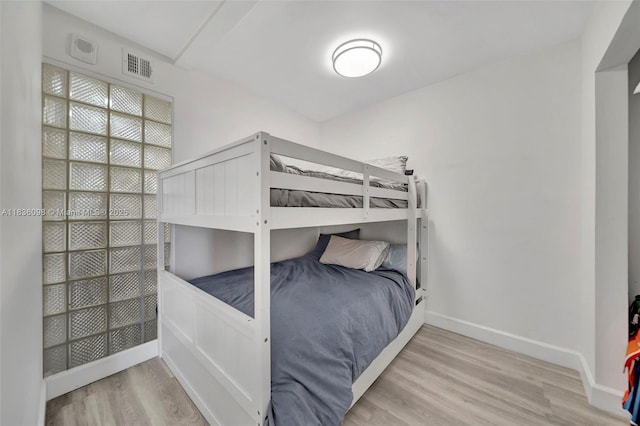 5005 Collins Ave Unit 815, Miami Beach, FL 33140 - unfurnished bedroom with wood finished floors and baseboards