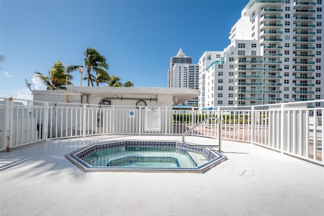 5005 Collins Ave Unit 815, Miami Beach, FL 33140 - view of swimming pool featuring a hot tub and a city view