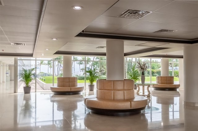 5005 Collins Ave Unit 815, Miami Beach, FL 33140 - lobby with a wall of windows and a paneled ceiling