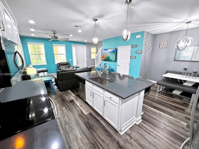 4126 Cascada Cir, Cooper City, FL 33024 - kitchen with stainless steel dishwasher, dark countertops, dark wood-style flooring, a ceiling fan, and recessed lighting