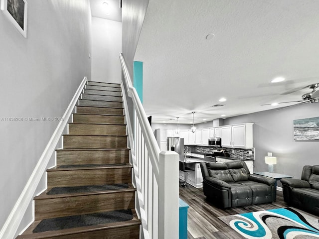 4126 Cascada Cir, Cooper City, FL 33024 - stairs with wood finished floors, ceiling fan, and recessed lighting