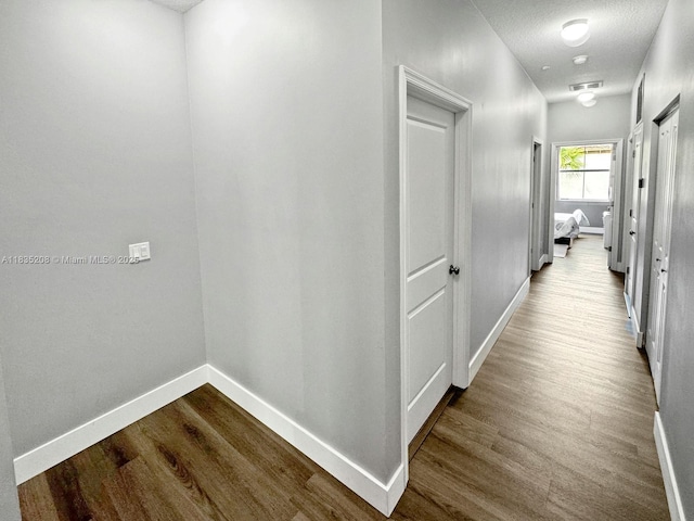 4126 Cascada Cir, Cooper City, FL 33024 - hall featuring dark wood-style flooring and baseboards