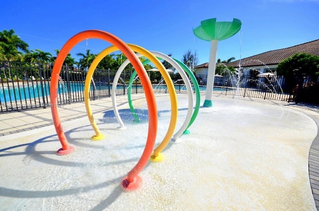 4126 Cascada Cir, Cooper City, FL 33024 - view of playground featuring a water play area and a community pool