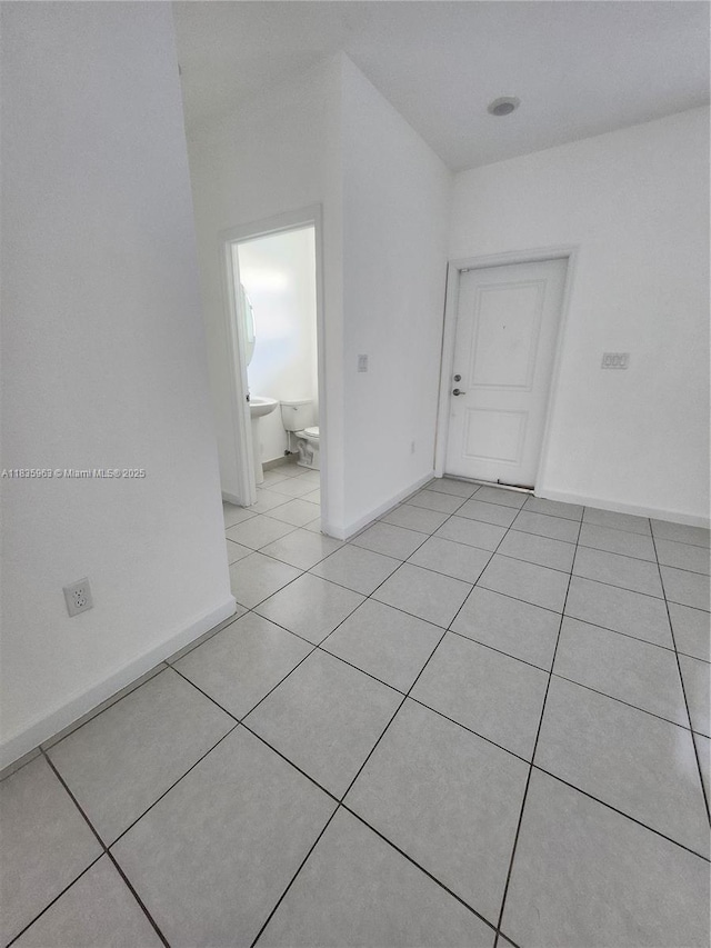 2693 SE 19th St, Homestead, FL 33035 - unfurnished room with light tile patterned floors and baseboards