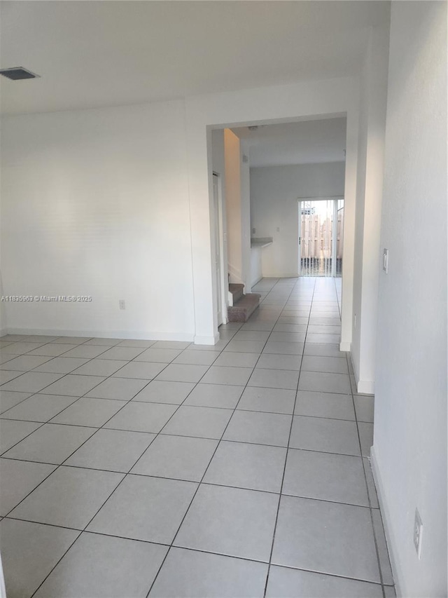 2693 SE 19th St, Homestead, FL 33035 - hall with light tile patterned flooring and baseboards