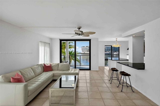 1600 S Bayshore Ln Unit 3A, Coconut Grove, FL 33133 - living room featuring a chandelier, healthy amount of natural light, light tile patterned flooring, and ceiling fan