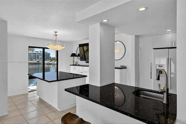 1600 S Bayshore Ln Unit 3A, Coconut Grove, FL 33133 - kitchen featuring fridge with ice dispenser, a chandelier, light tile patterned floors, recessed lighting, and decorative light fixtures