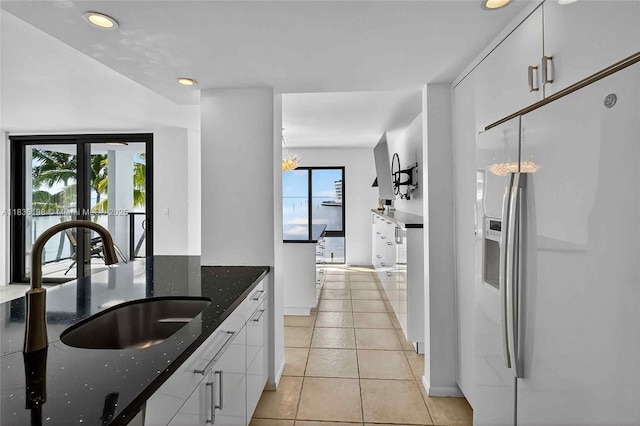 1600 S Bayshore Ln Unit 3A, Coconut Grove, FL 33133 - kitchen featuring fridge with ice dispenser, white cabinets, dark stone countertops, light tile patterned floors, and recessed lighting