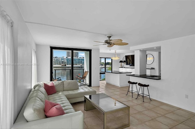 1600 S Bayshore Ln Unit 3A, Coconut Grove, FL 33133 - living area featuring light tile patterned floors and ceiling fan