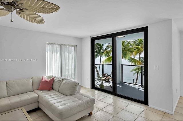 1600 S Bayshore Ln Unit 3A, Coconut Grove, FL 33133 - living room with healthy amount of natural light, light tile patterned flooring, and ceiling fan