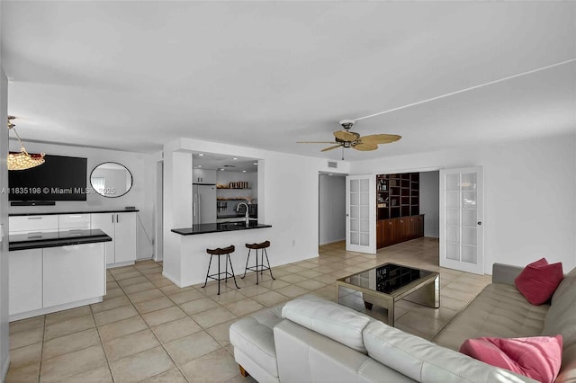 1600 S Bayshore Ln Unit 3A, Coconut Grove, FL 33133 - living area with light tile patterned floors, french doors, and a ceiling fan