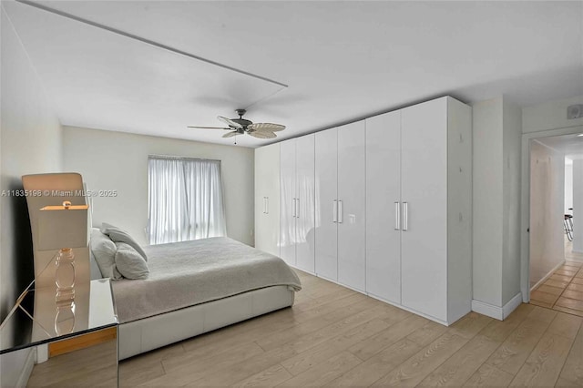1600 S Bayshore Ln Unit 3A, Coconut Grove, FL 33133 - bedroom with light wood finished floors and ceiling fan